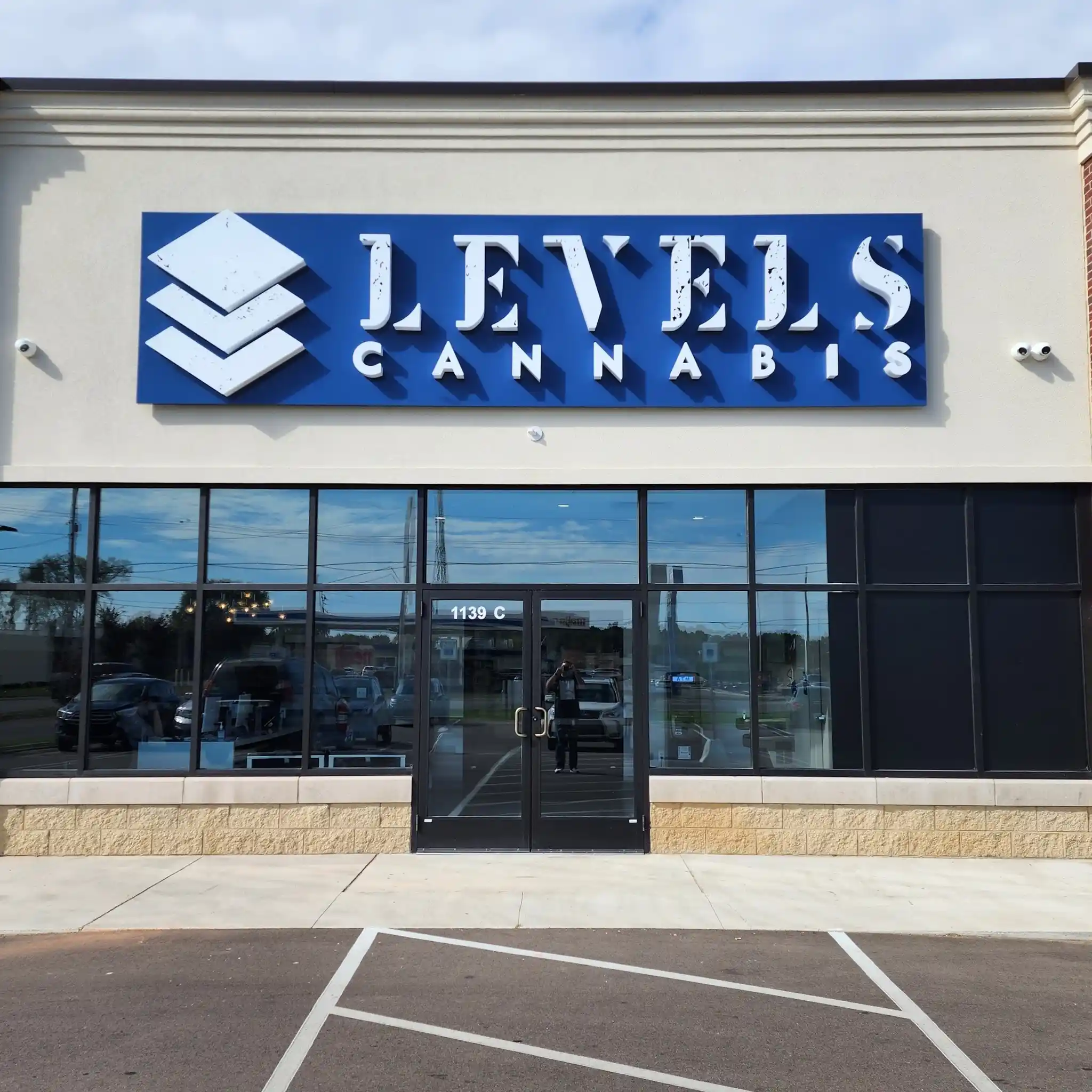 Levels Cannabis – Trusted Michigan Cannabis Dispensary Exterior view of Levels Cannabis retail location in Michigan, showcasing the building and brand signage.